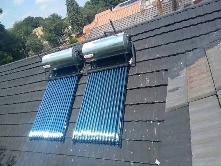 Solar vacuum tube collector on a tiled roof