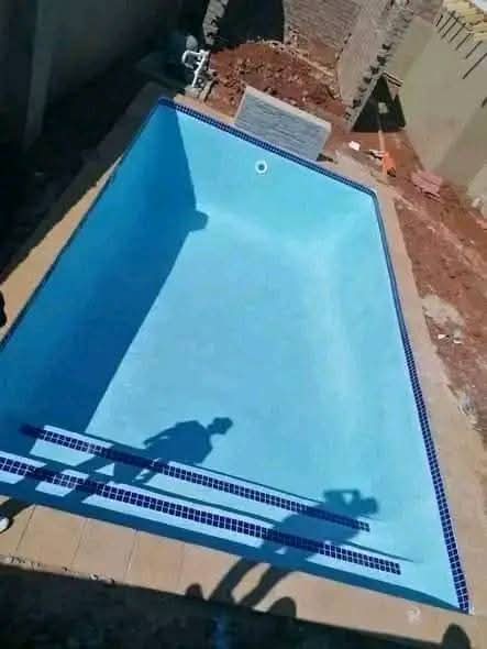 Small plunge pool with blue mosaic tiles