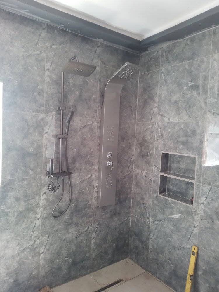 Tiled shower corner during installation