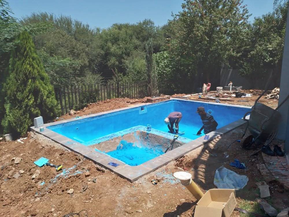 Our team plastering a new swimming pool