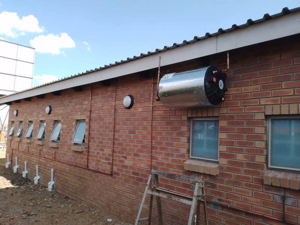 Solar geyser fitted on a brick building